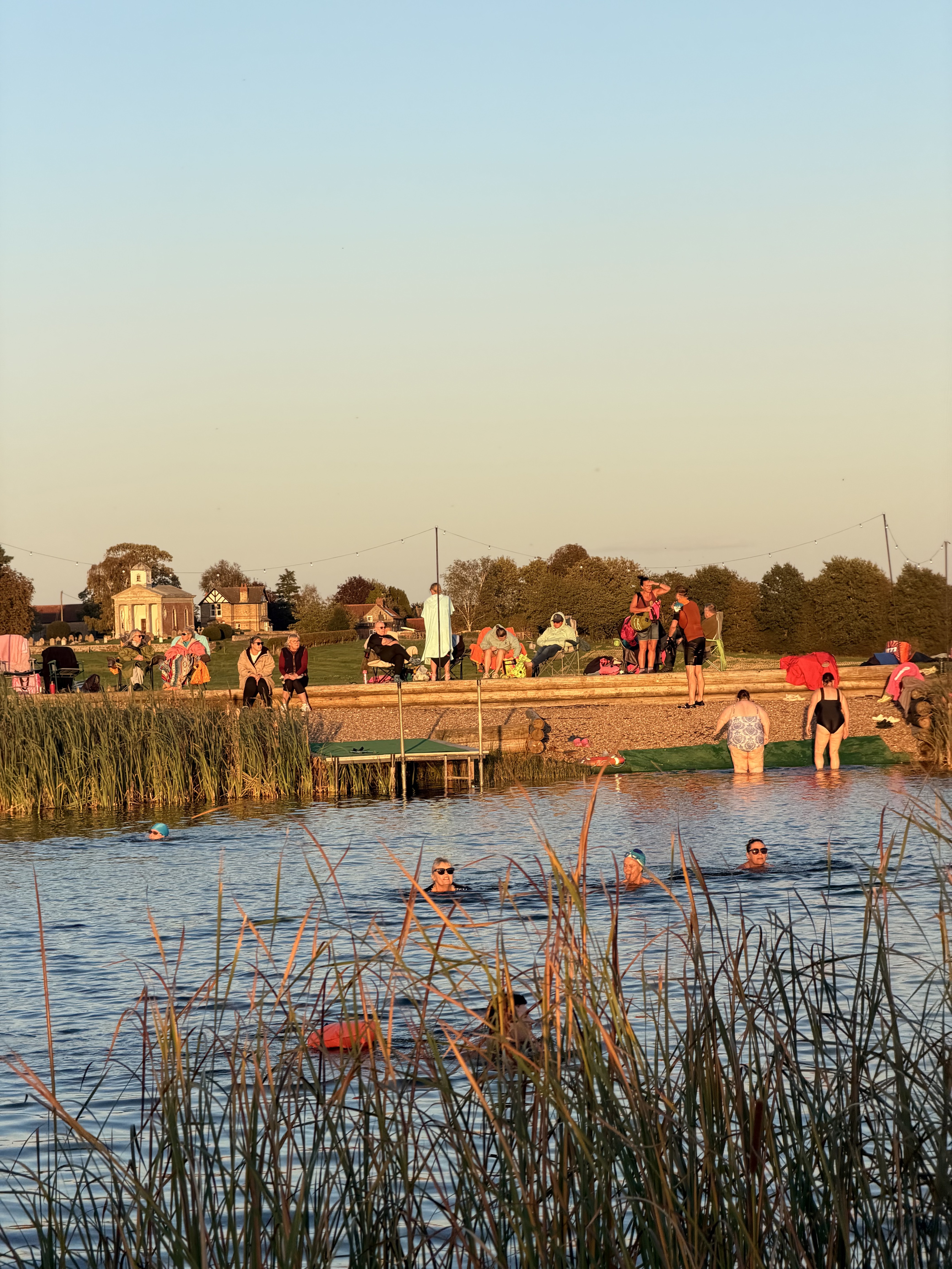 Swimmers and friends gathering beside the water